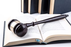 Judge's gavel and judgment book in the courthouse