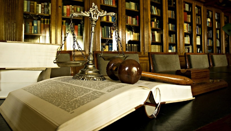 Judge's gavel and book in court